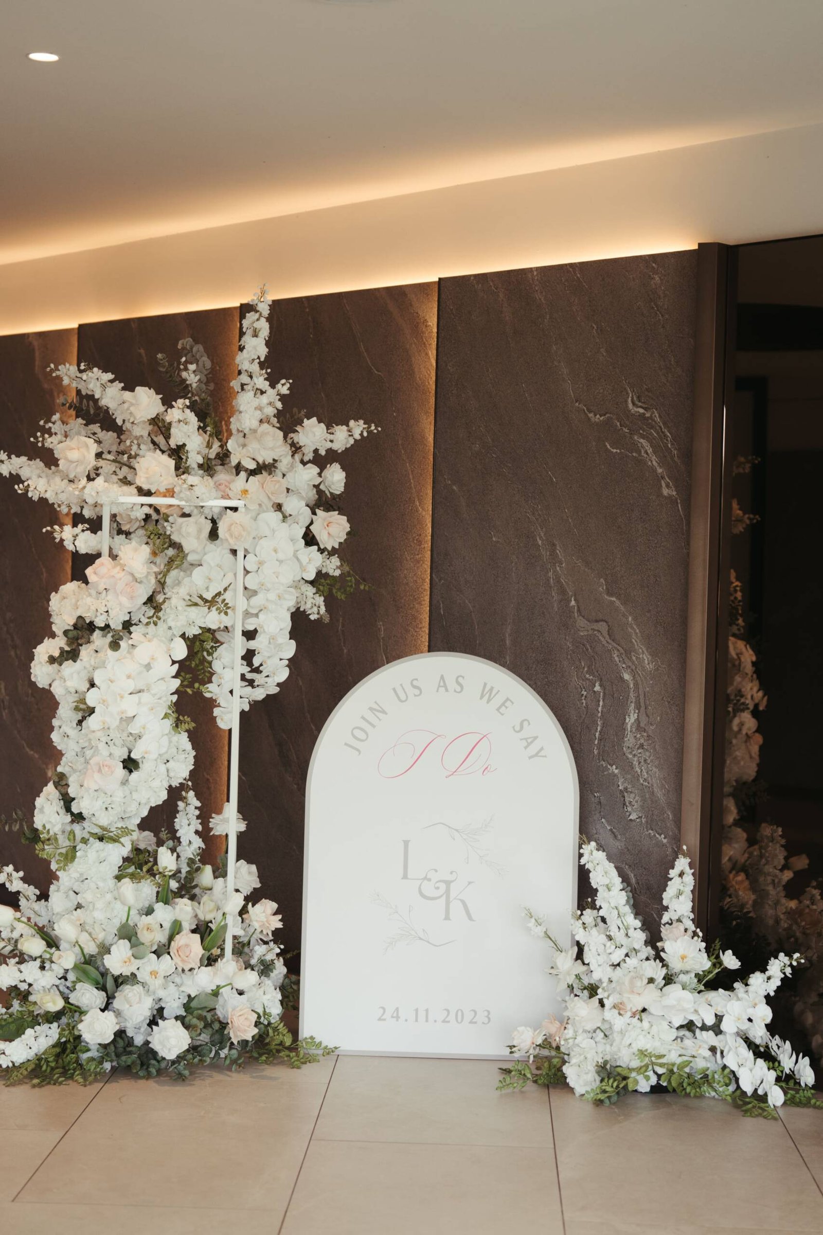 welcome board for wedding guests and floral decorations by g luxe events in melbourne